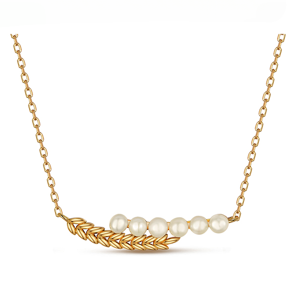 Gold necklace featuring a floral leaf design with three lustrous pearls elegantly arranged at its center.
